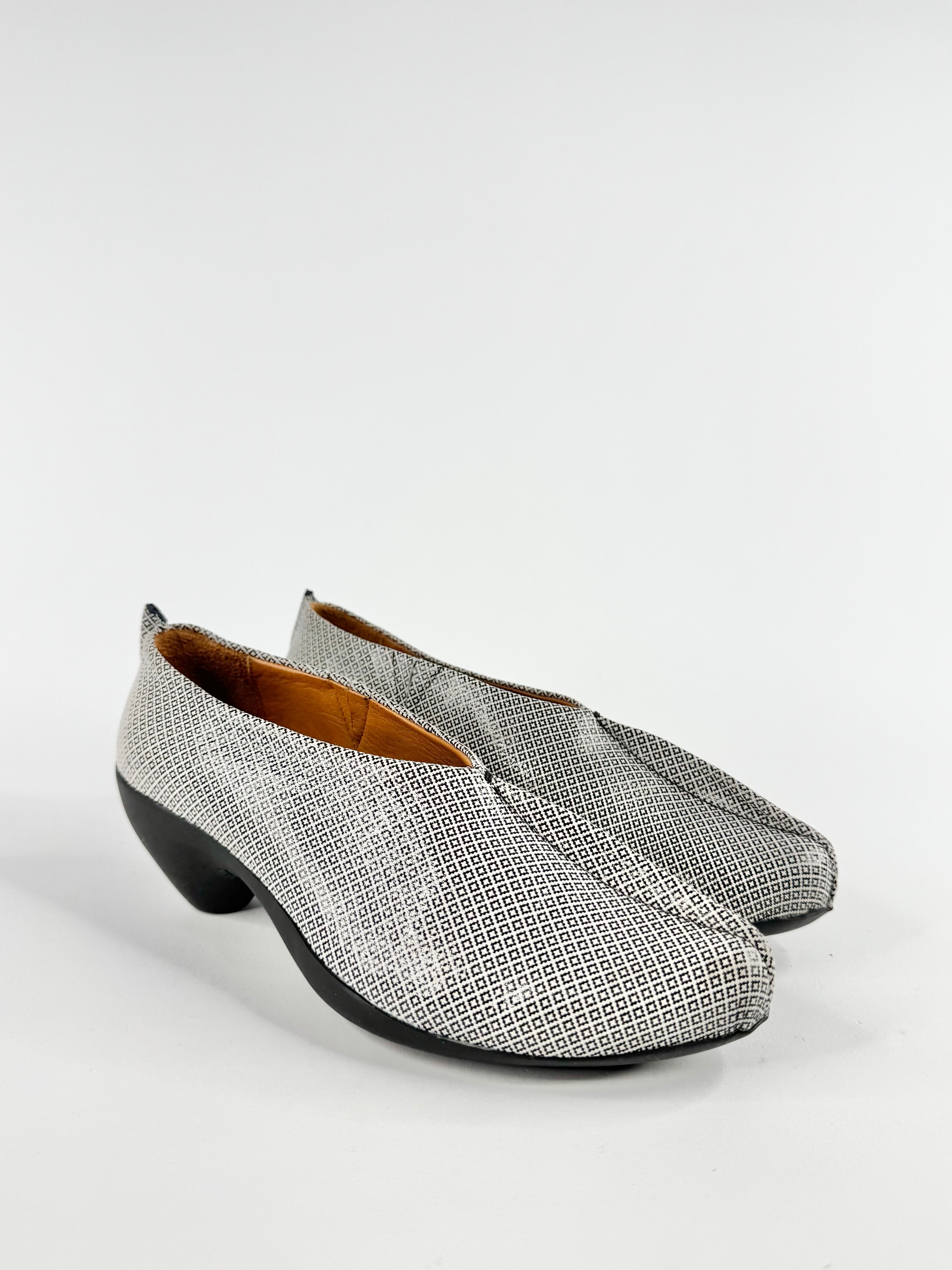 Pair of gray textured shoes on a white background