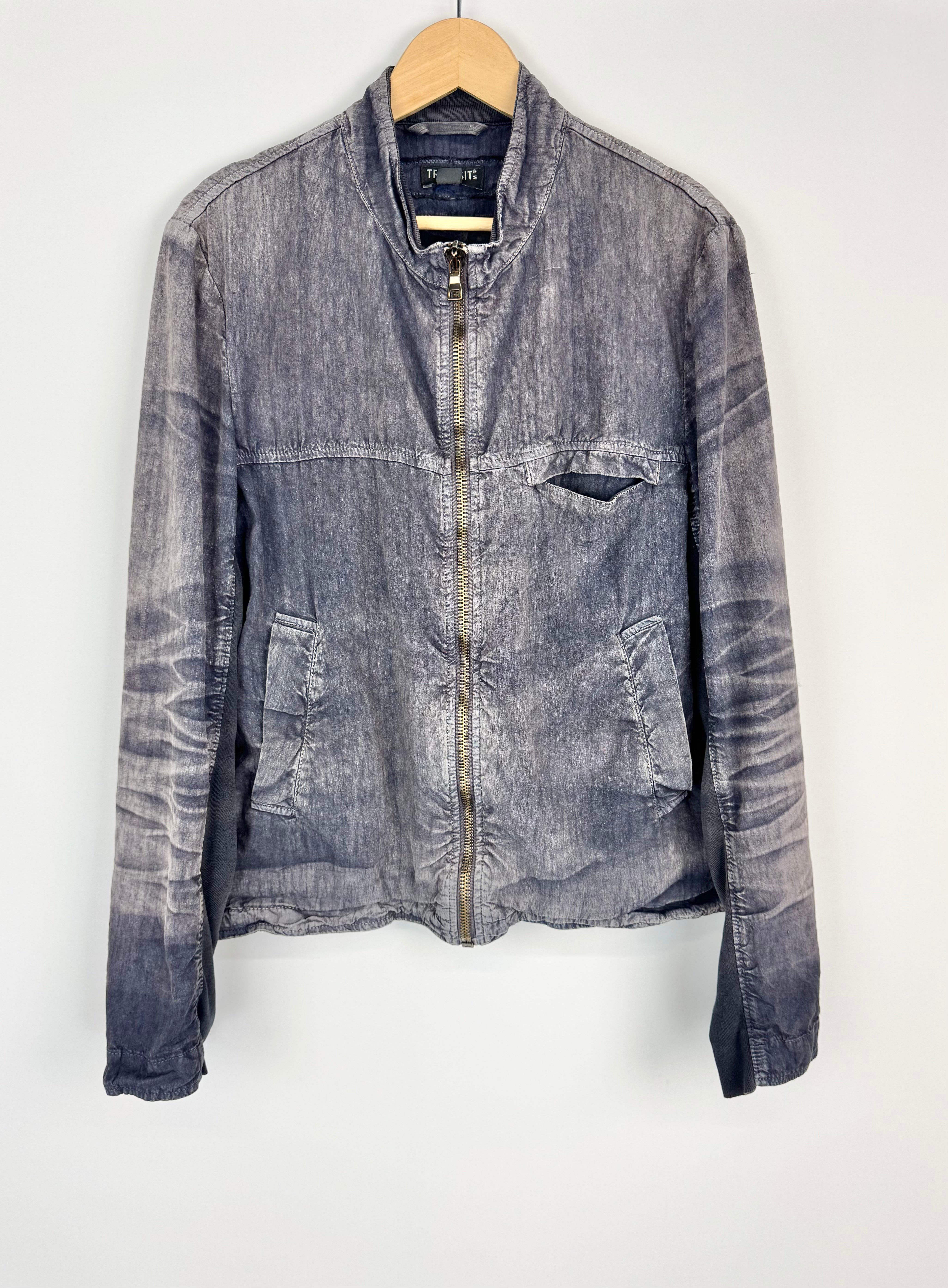 Denim jacket on a hanger against a white background