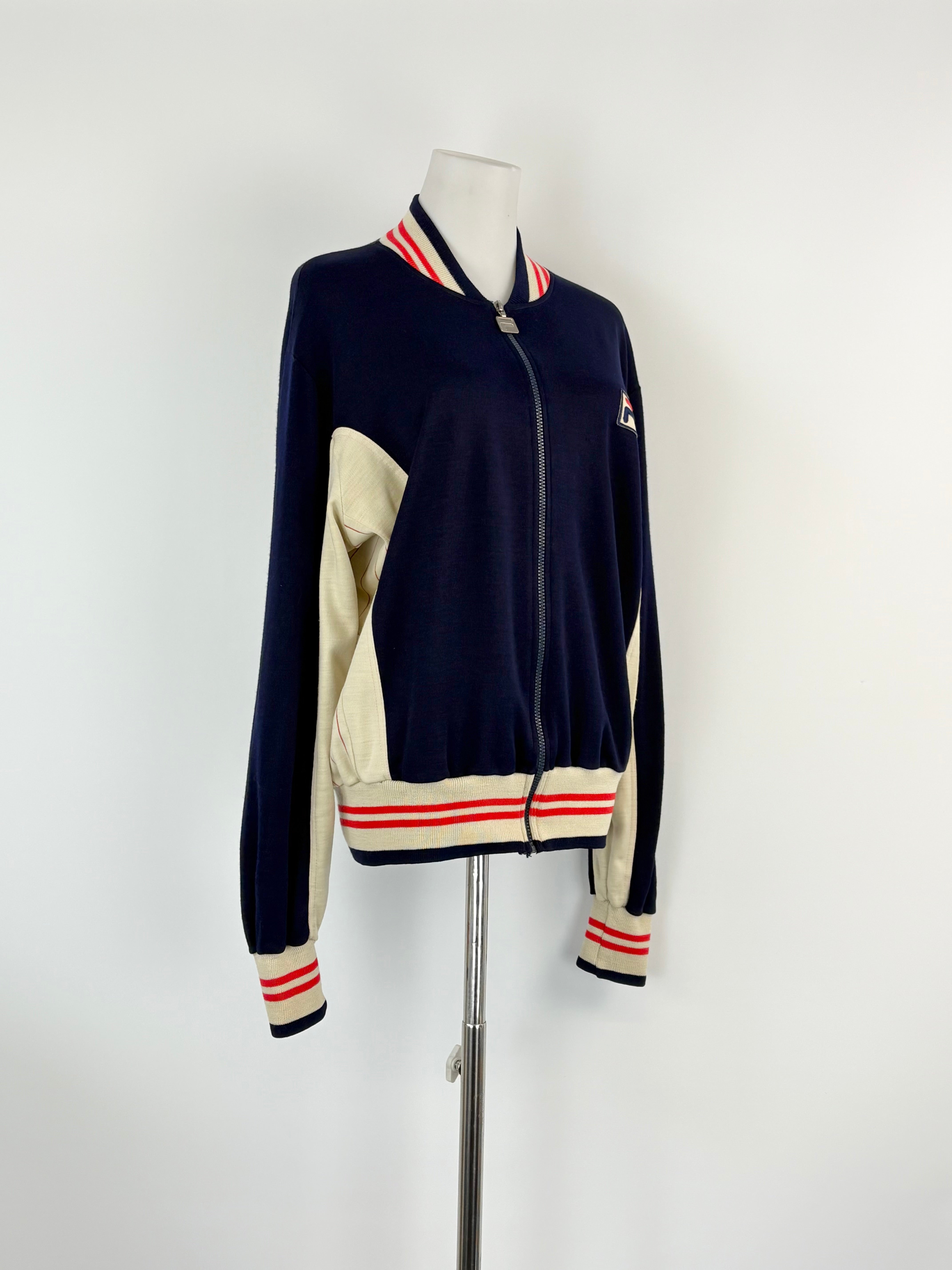 Navy and beige jacket with red and white stripes on a mannequin against a white background
