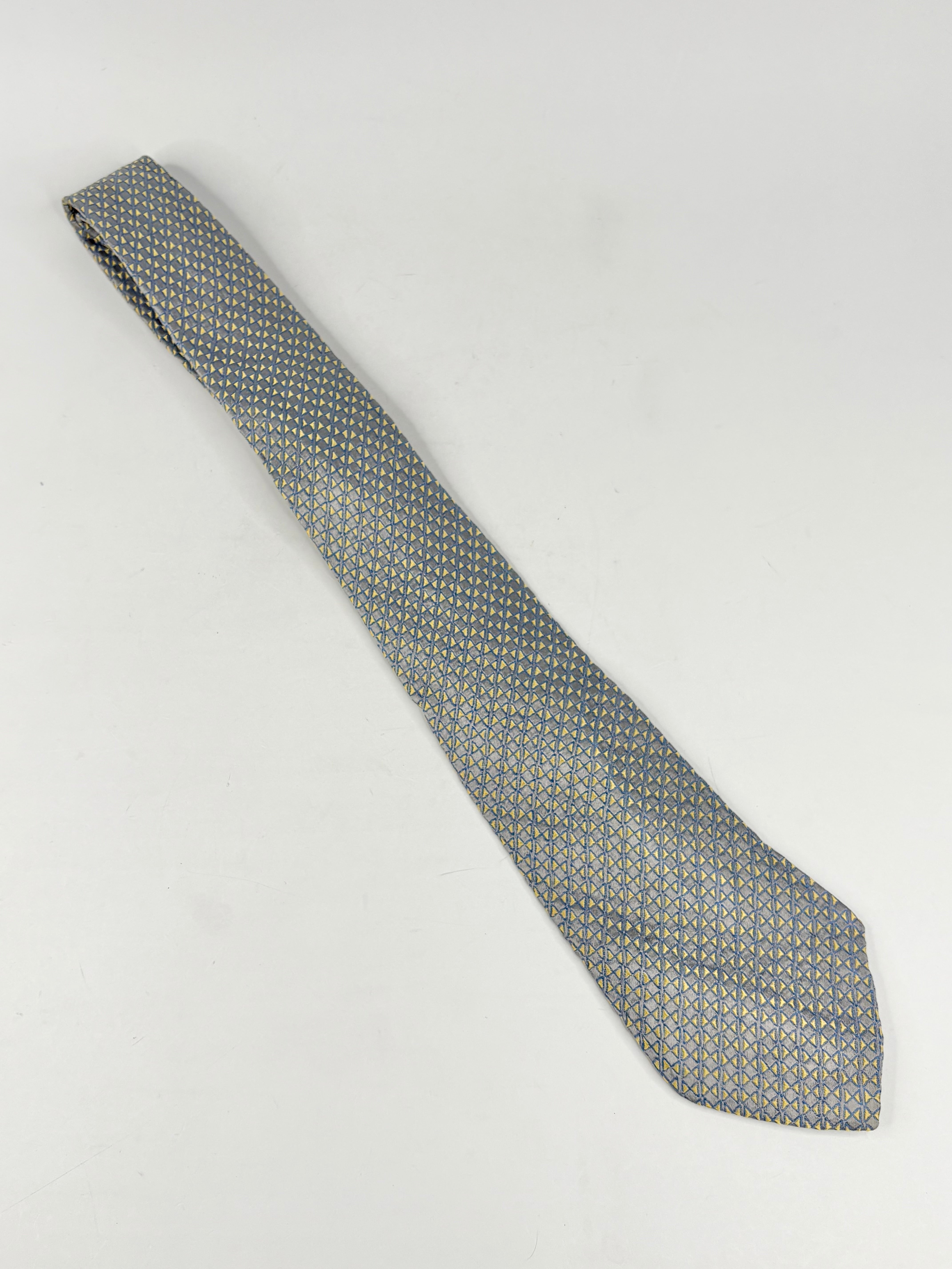 Gray patterned tie on a light gray background
