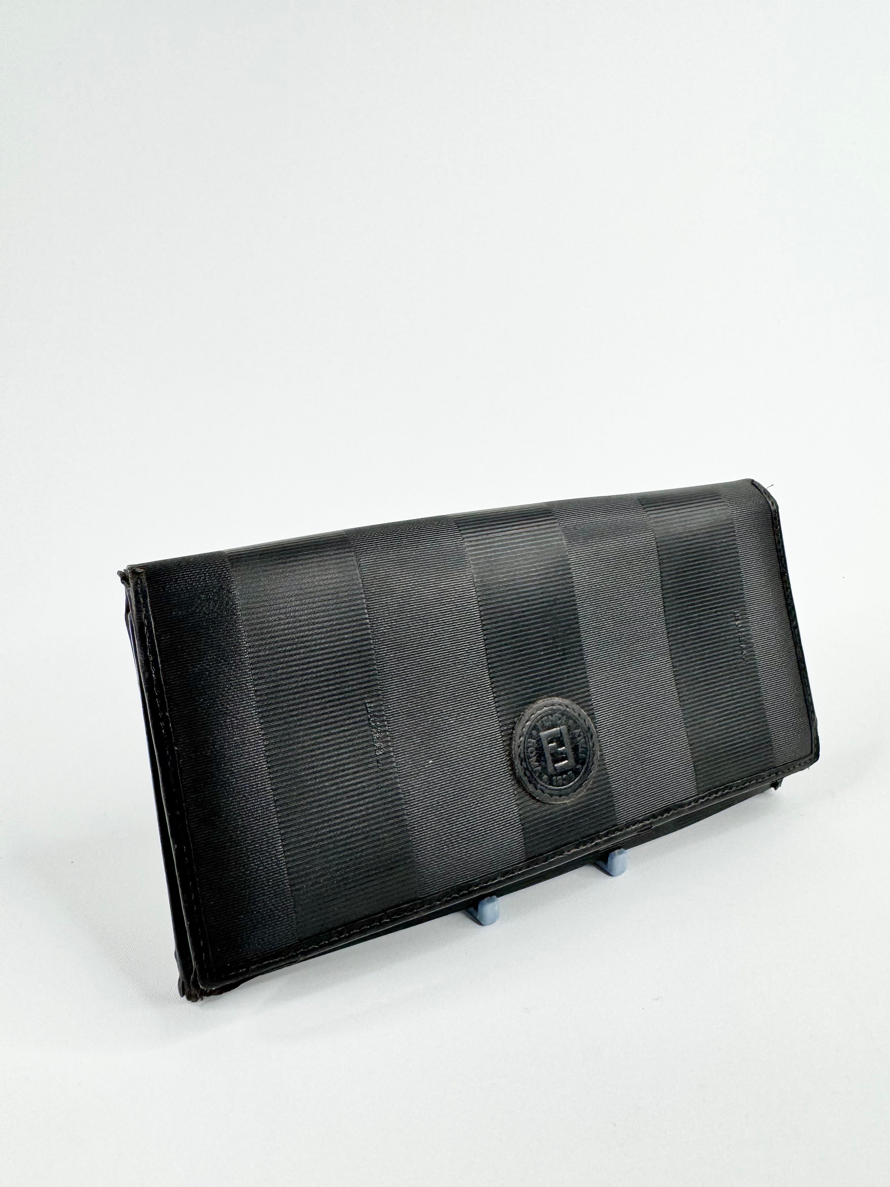 Black wallet with a brand logo on a white background
