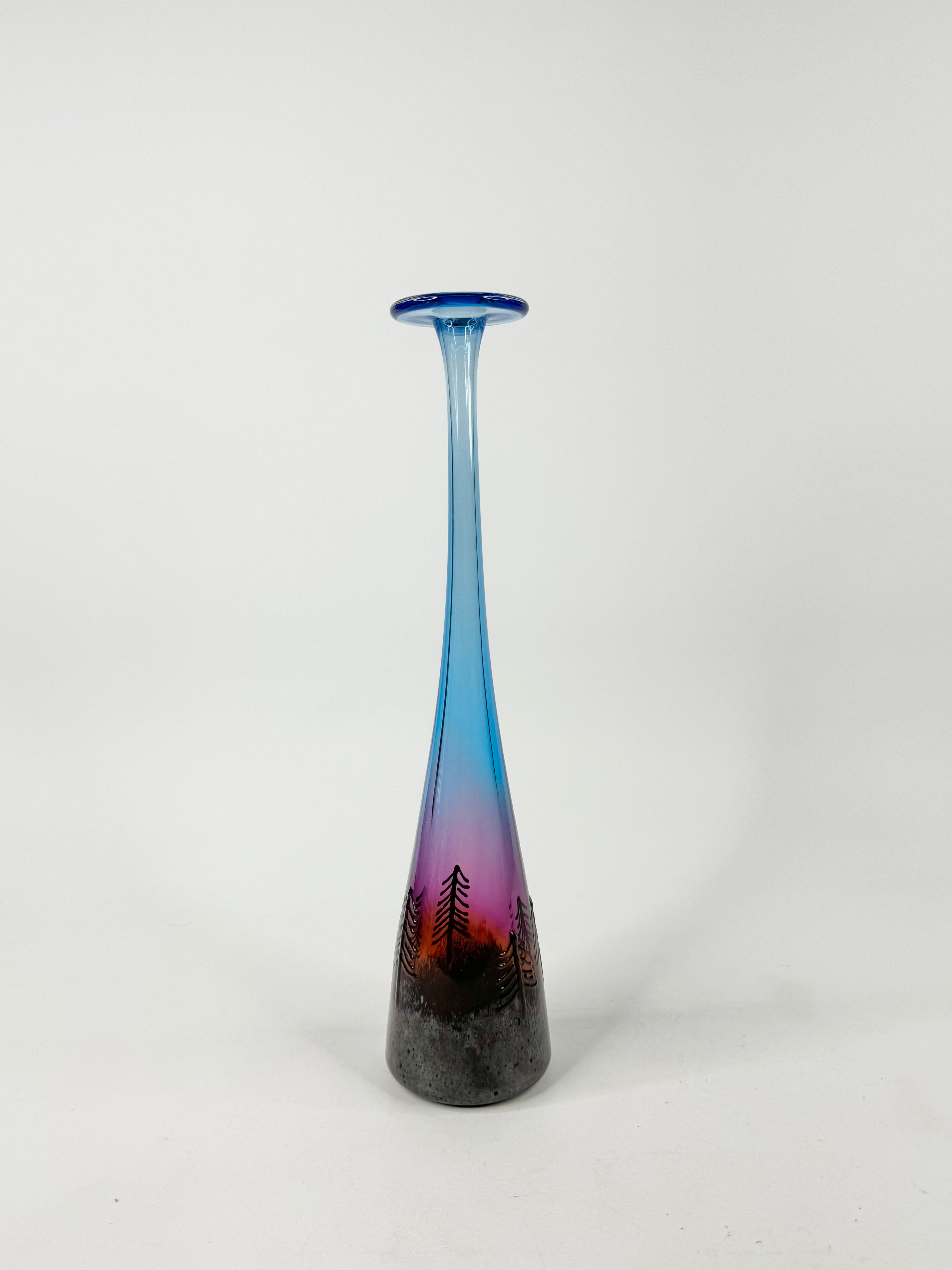Gradient blue to purple vase with a forest design on a white background