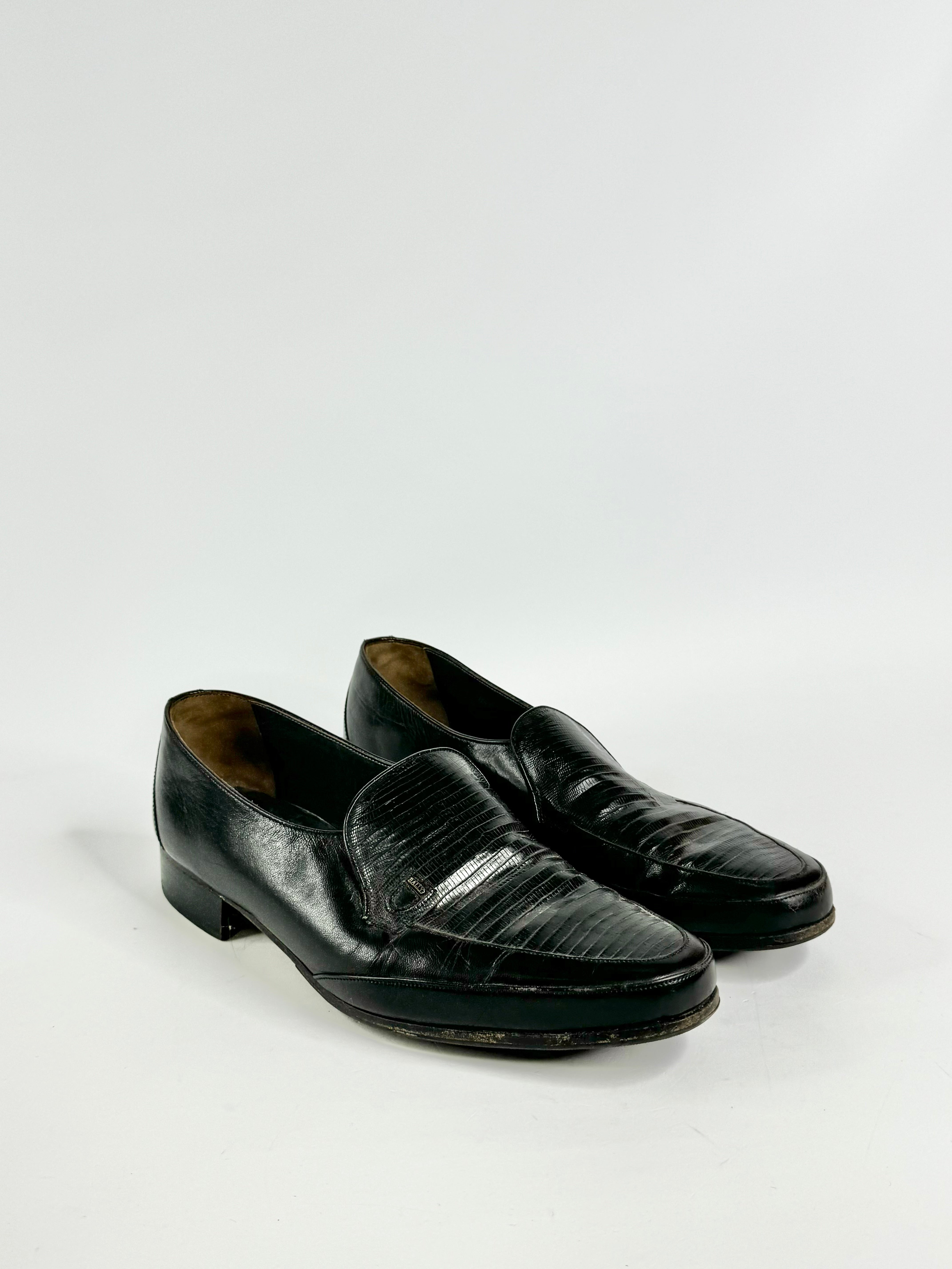 A pair of vintage Bally black textured loafers with the 'Bally' logo on the sides, displayed against a white background.