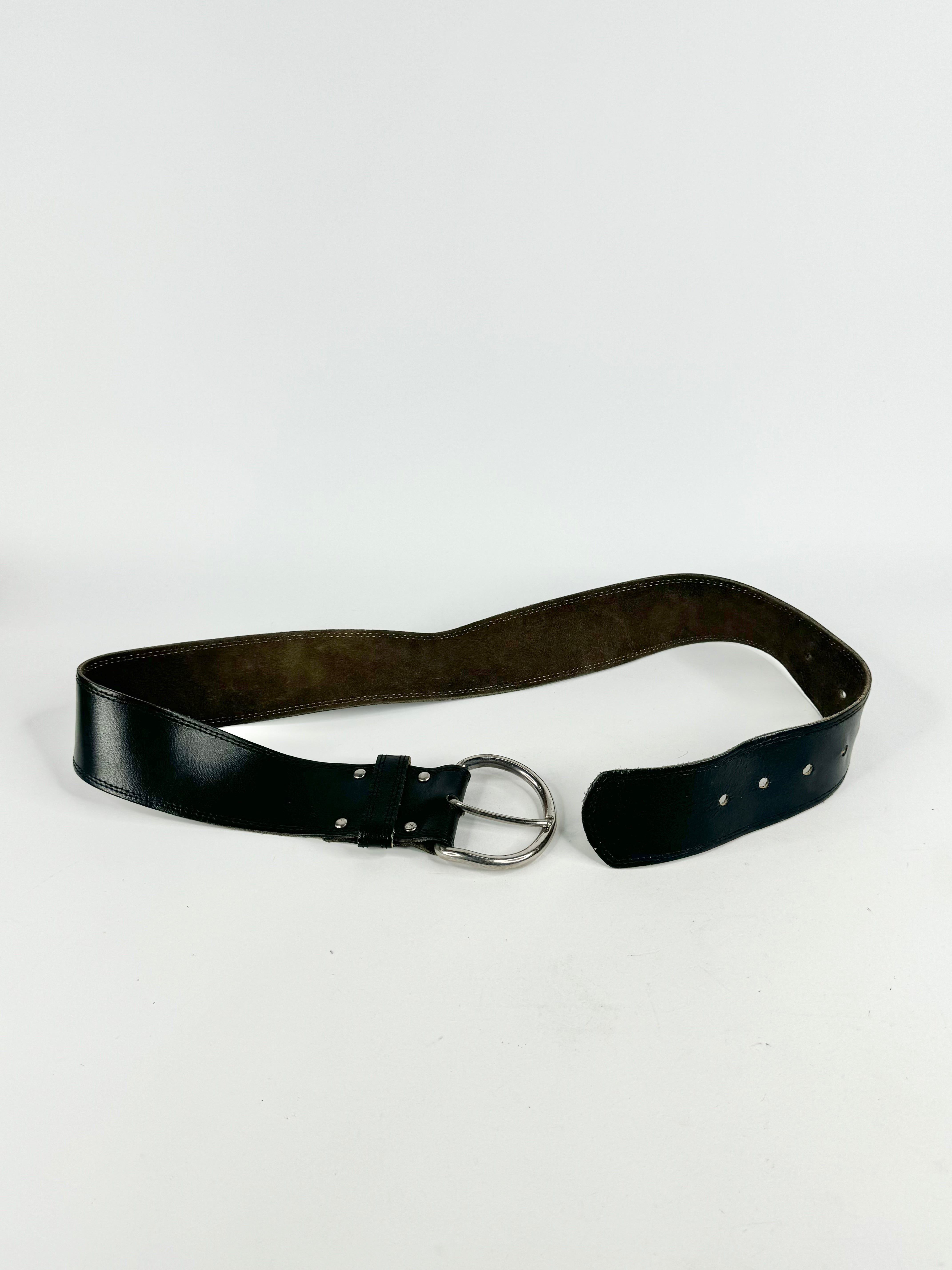 Black belt with a silver buckle on a white background