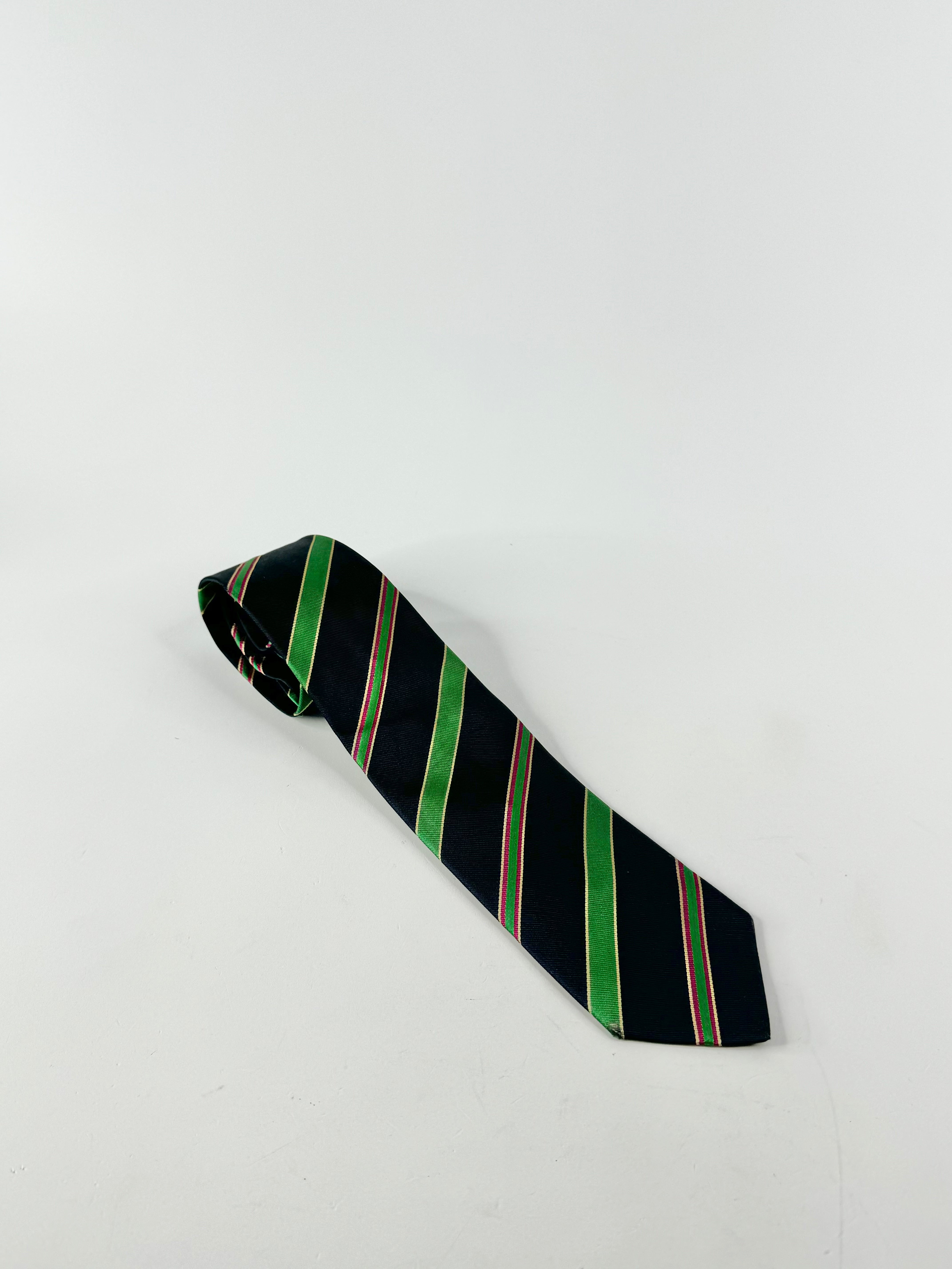 A vintage blue and green striped silk tie laid out on a white background.