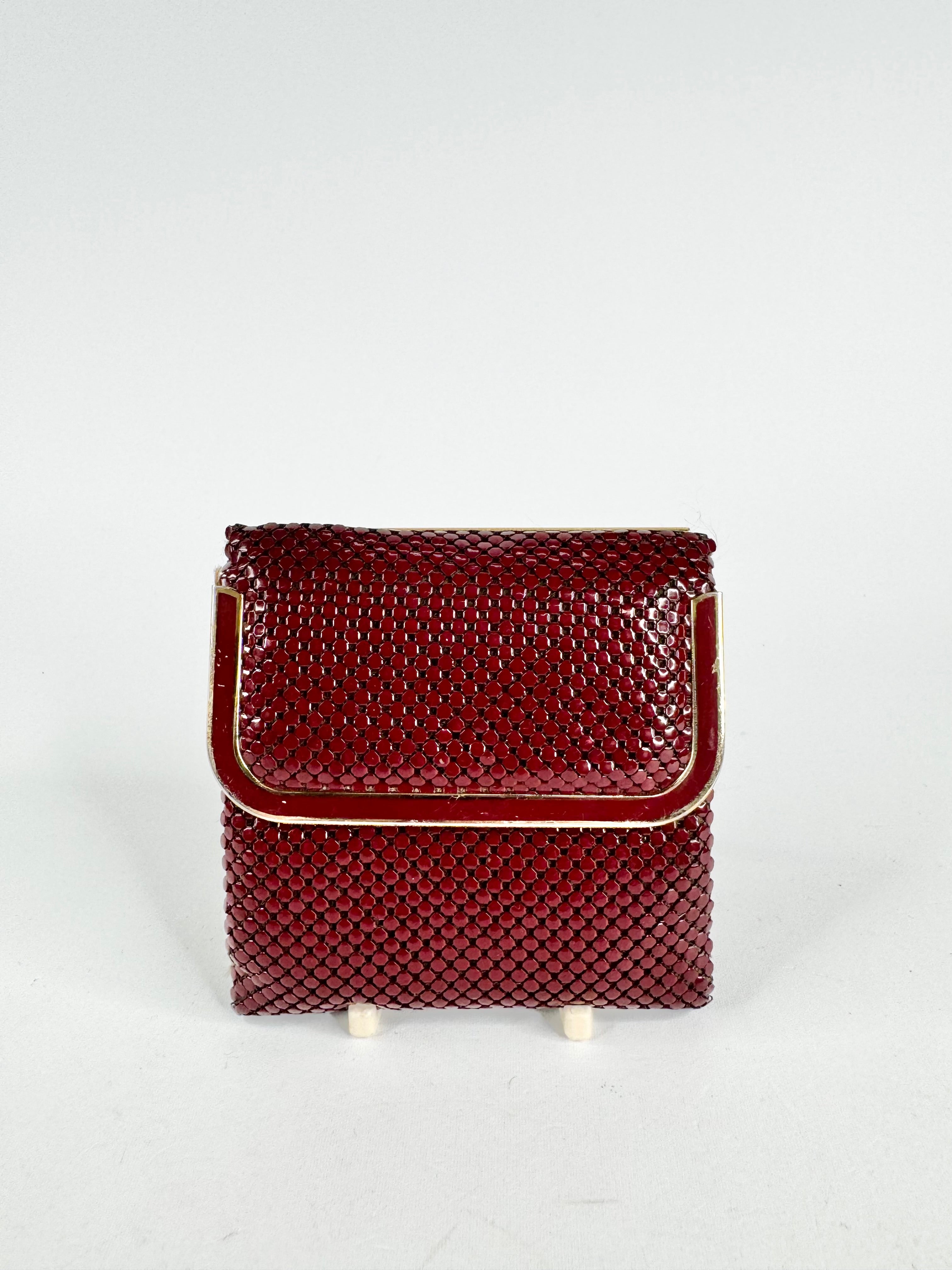 Brown woven handbag on a light gray background