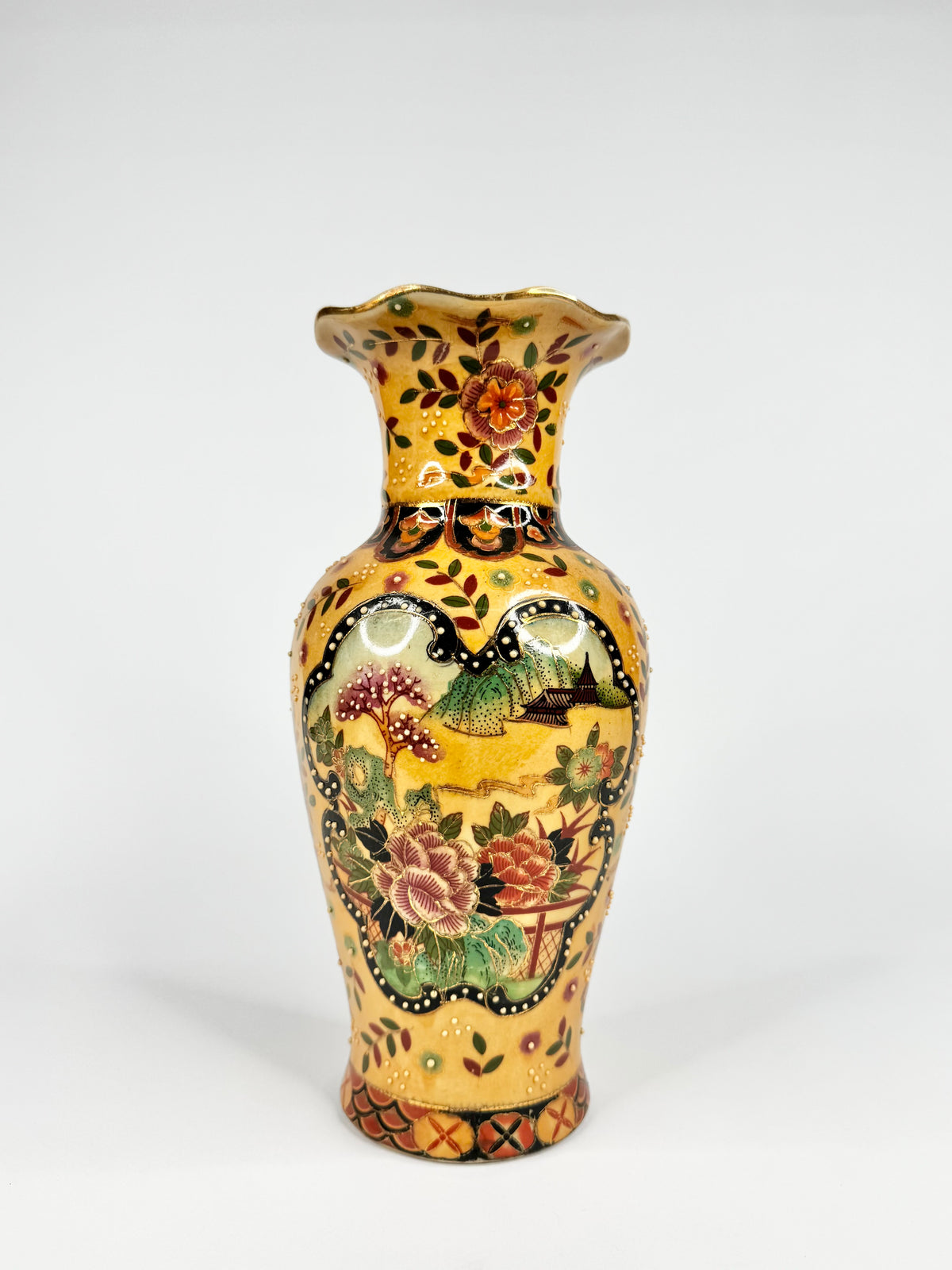 Decorative vase with floral patterns on a white background