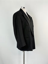 Black blazer on a mannequin against a white background