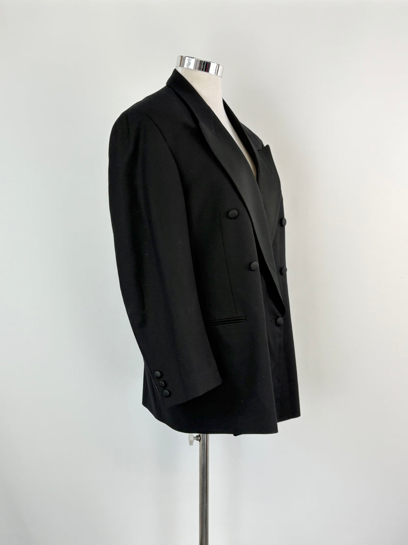 Black blazer on a mannequin against a white background