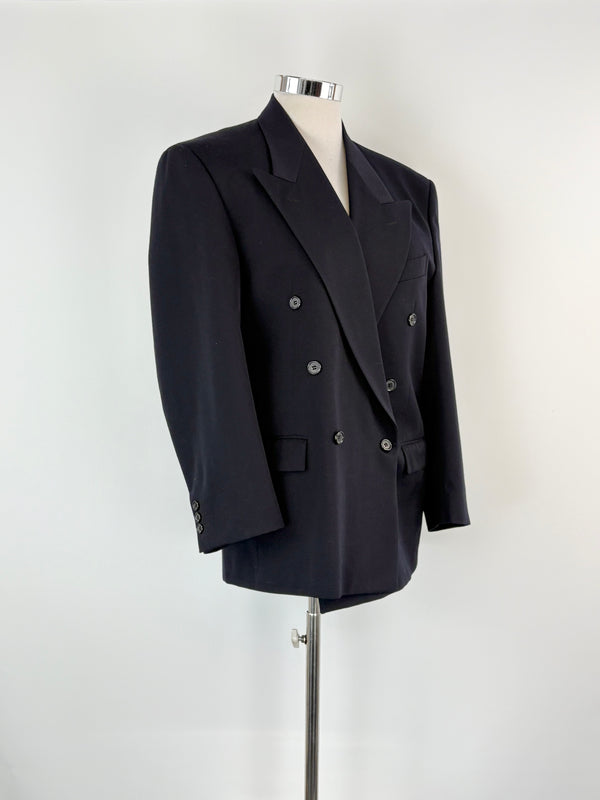 Black double-breasted suit jacket on a mannequin against a white background