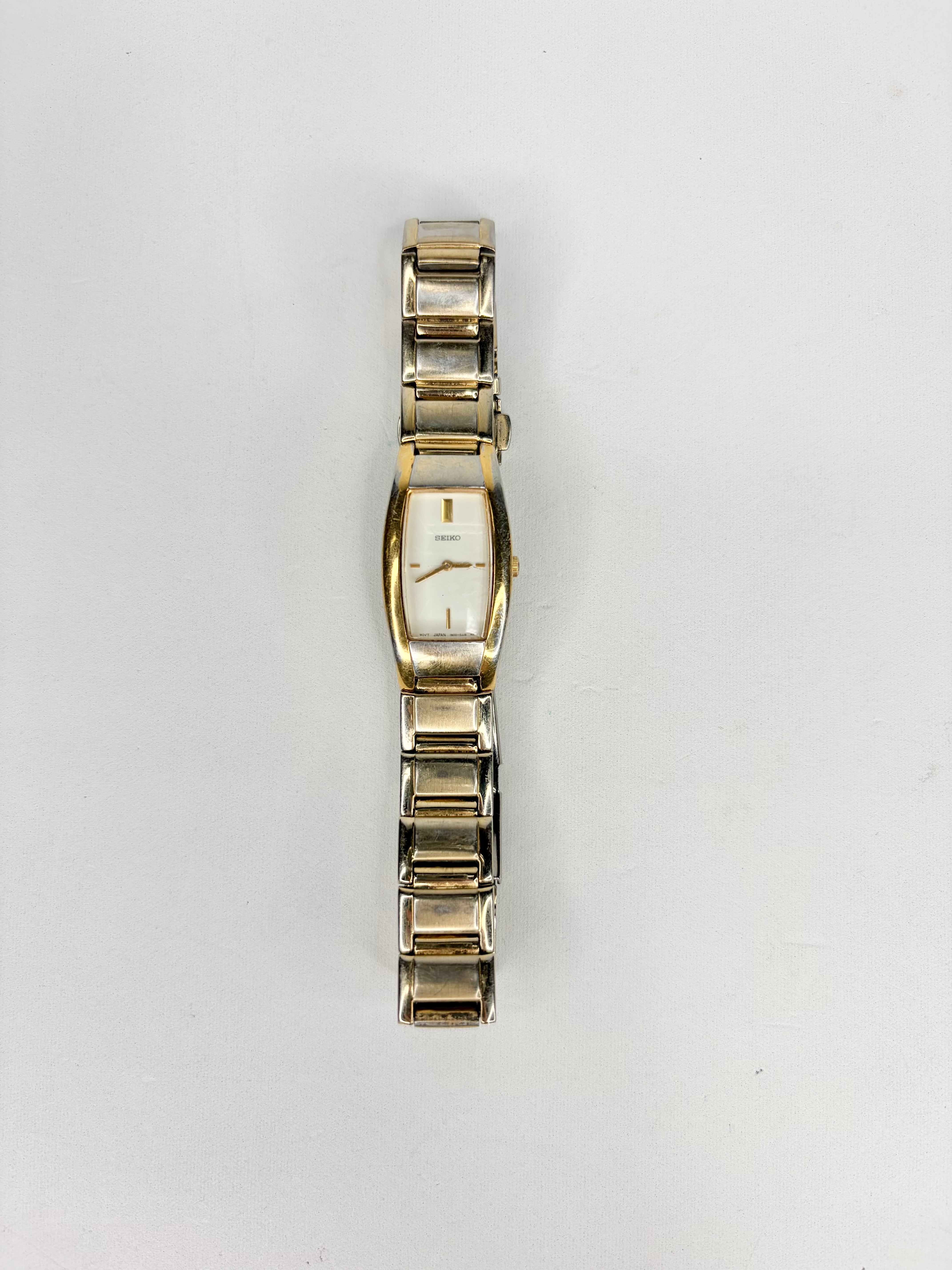 Gold watch on a white background