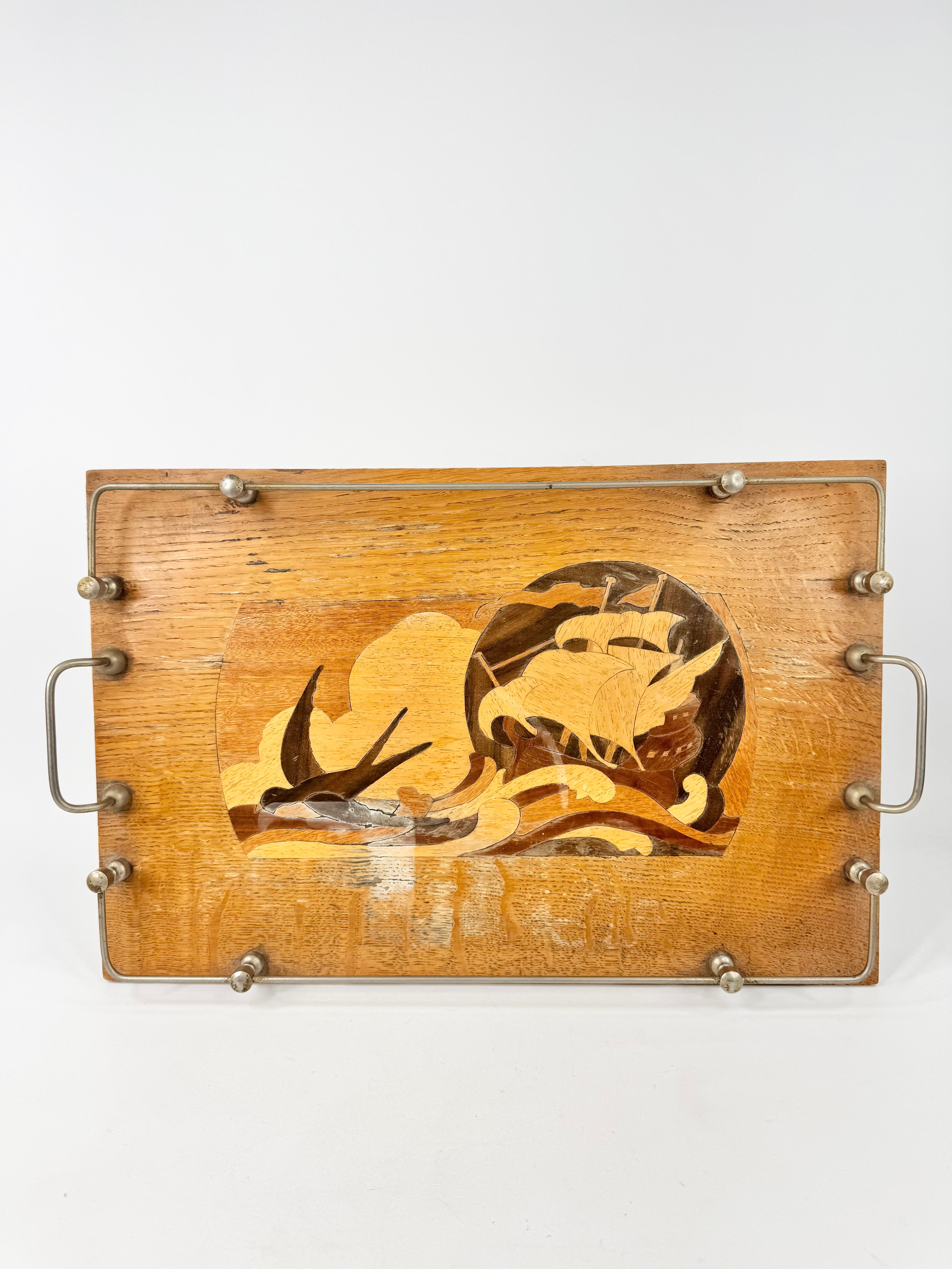 Wooden tray with decorative cutout design on a white background