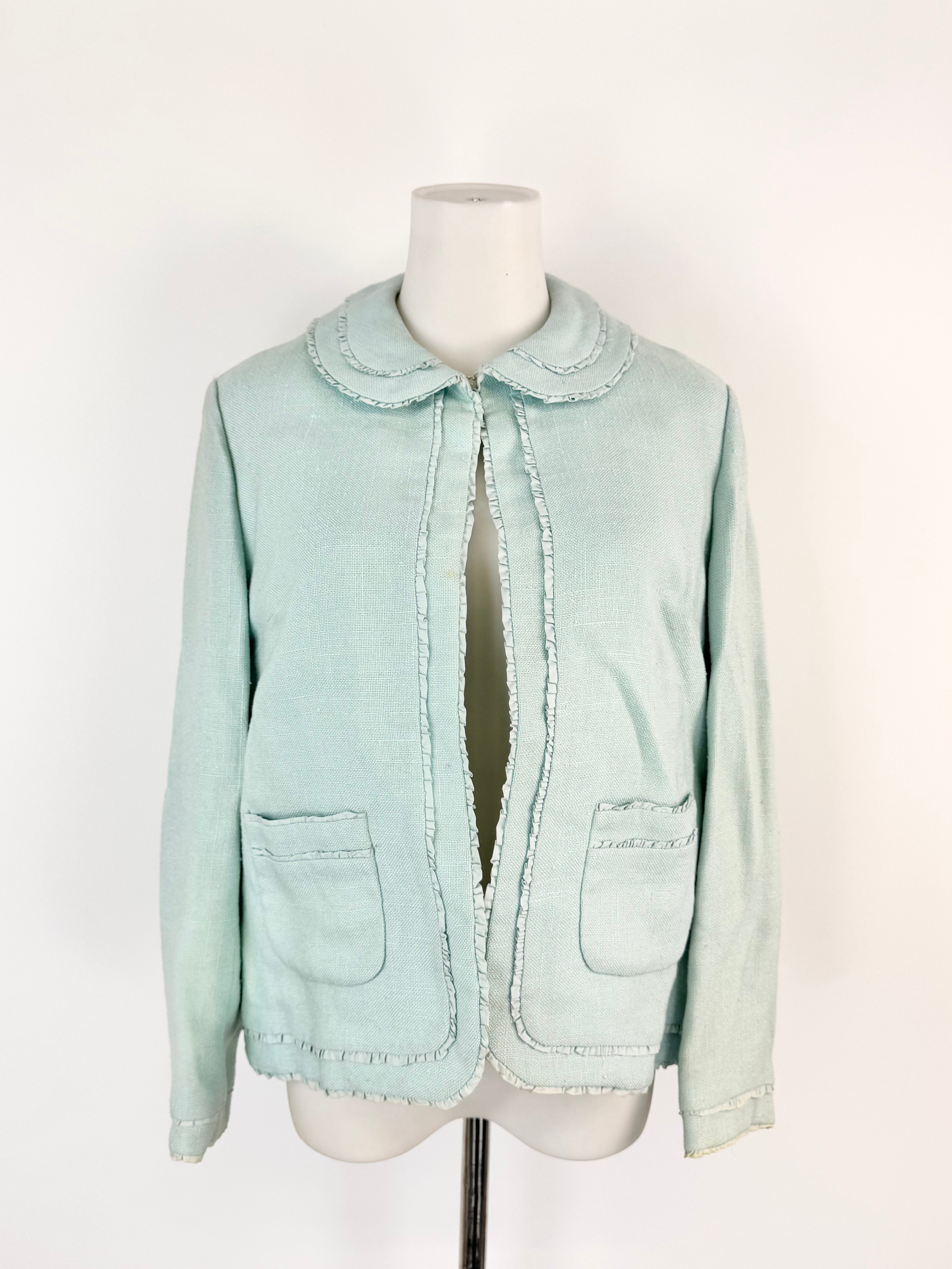 Light blue denim jacket on a mannequin against a white background