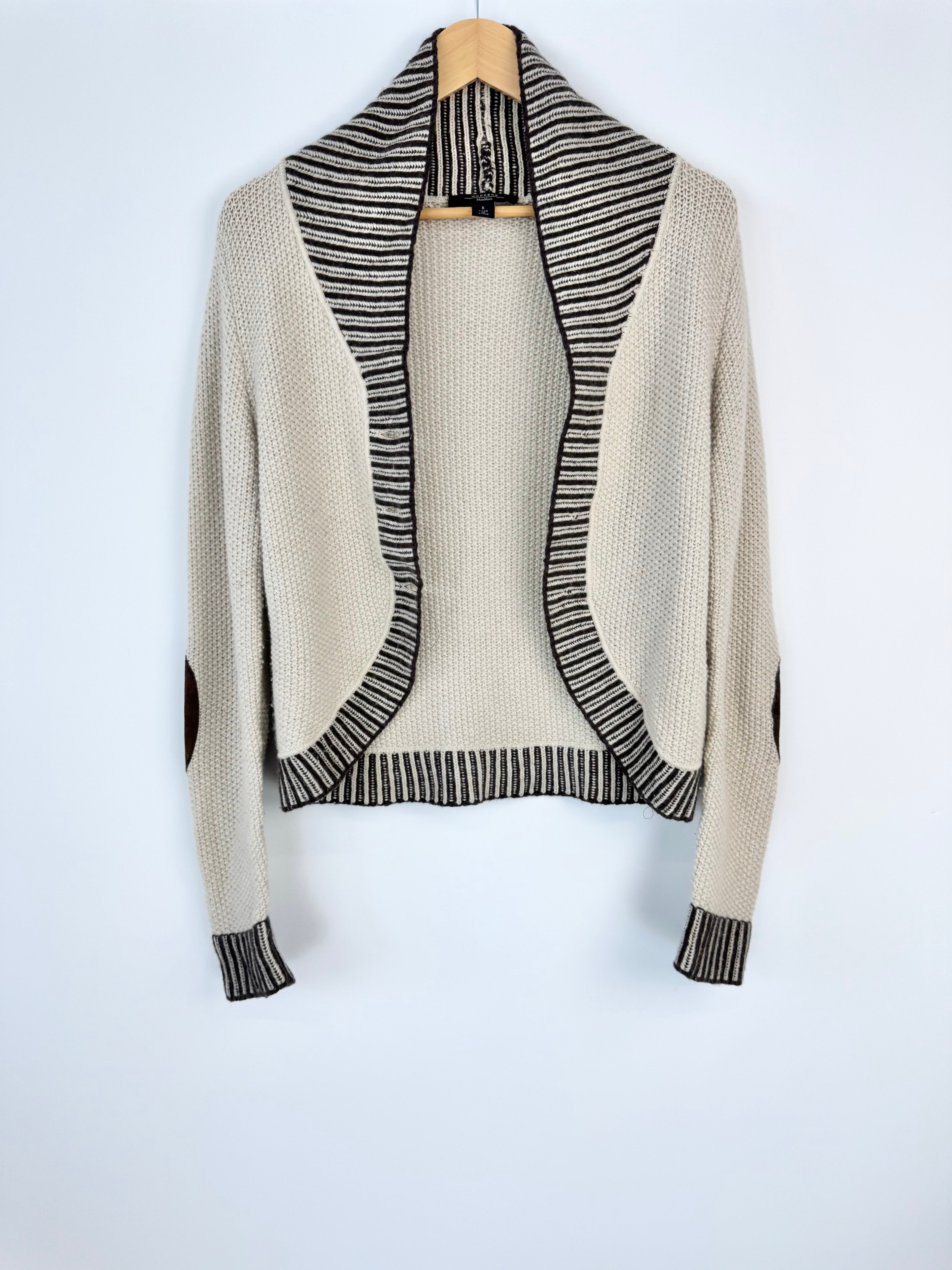 Beige cardigan with black striped pattern on a white background