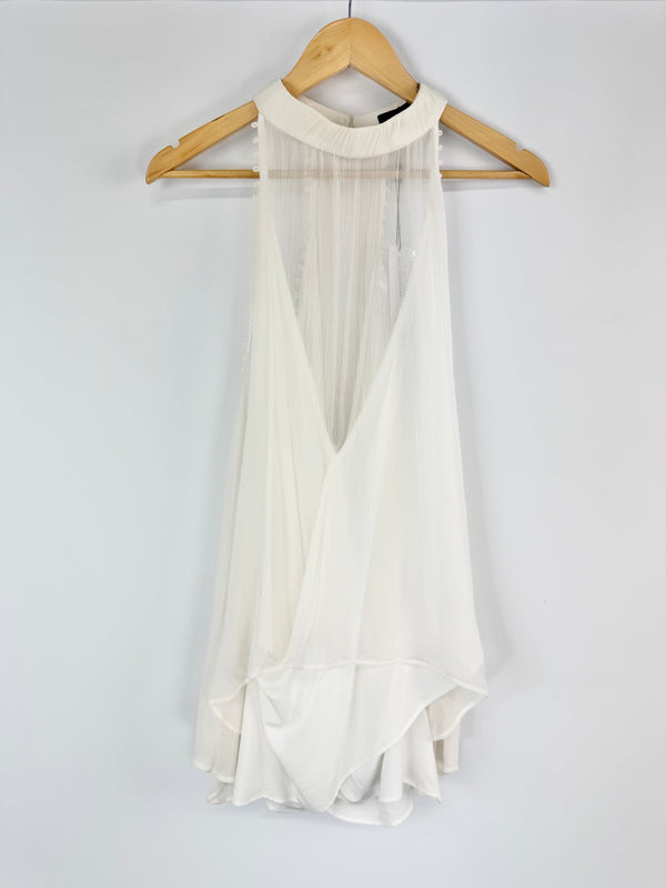 White dress on a hanger against a white background