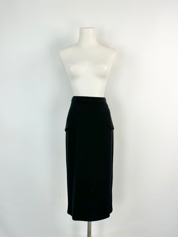 A black pencil skirt with two front panels displayed on a mannequin