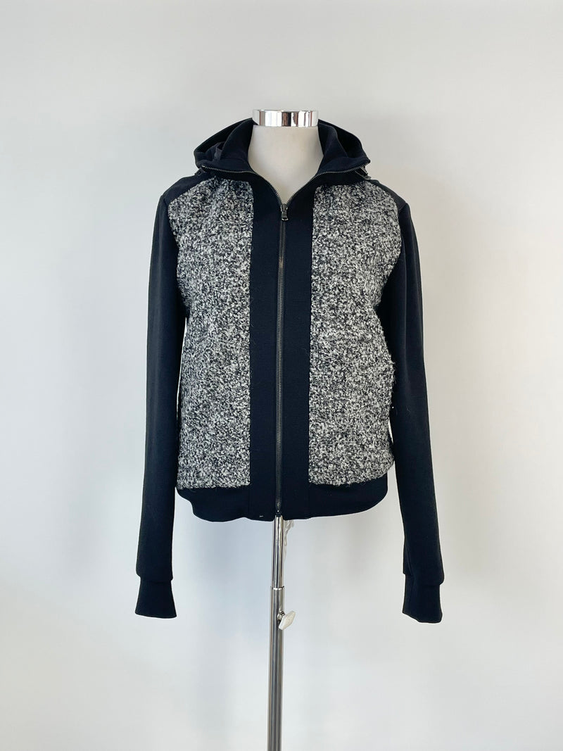 A hooded wool-blend jacket with black polyester trims, predominantly grey, by Korean label Wooyoungmi, displayed on a mannequin.