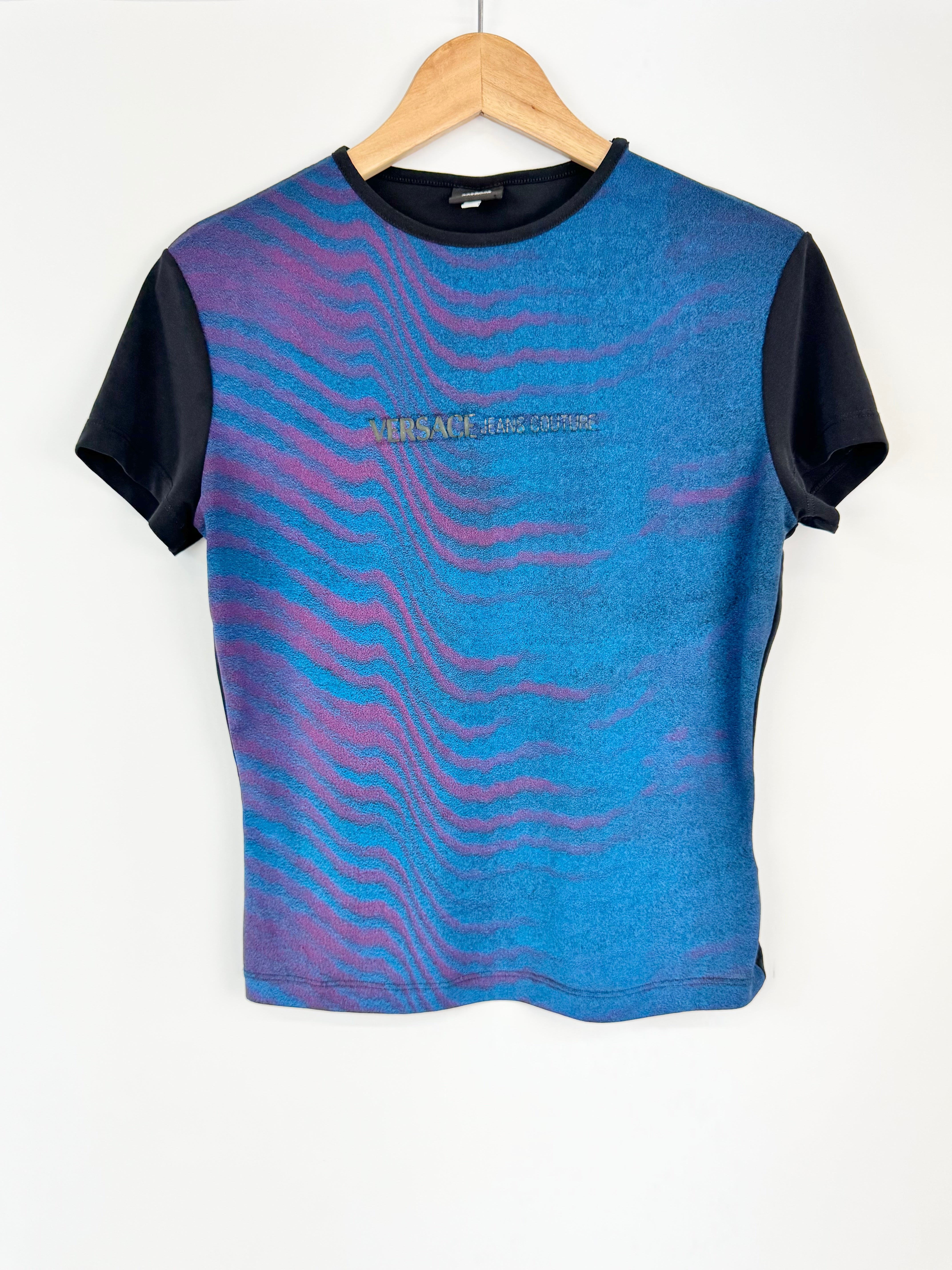 Blue and black sleeveless shirt with Versace logo on a hanger