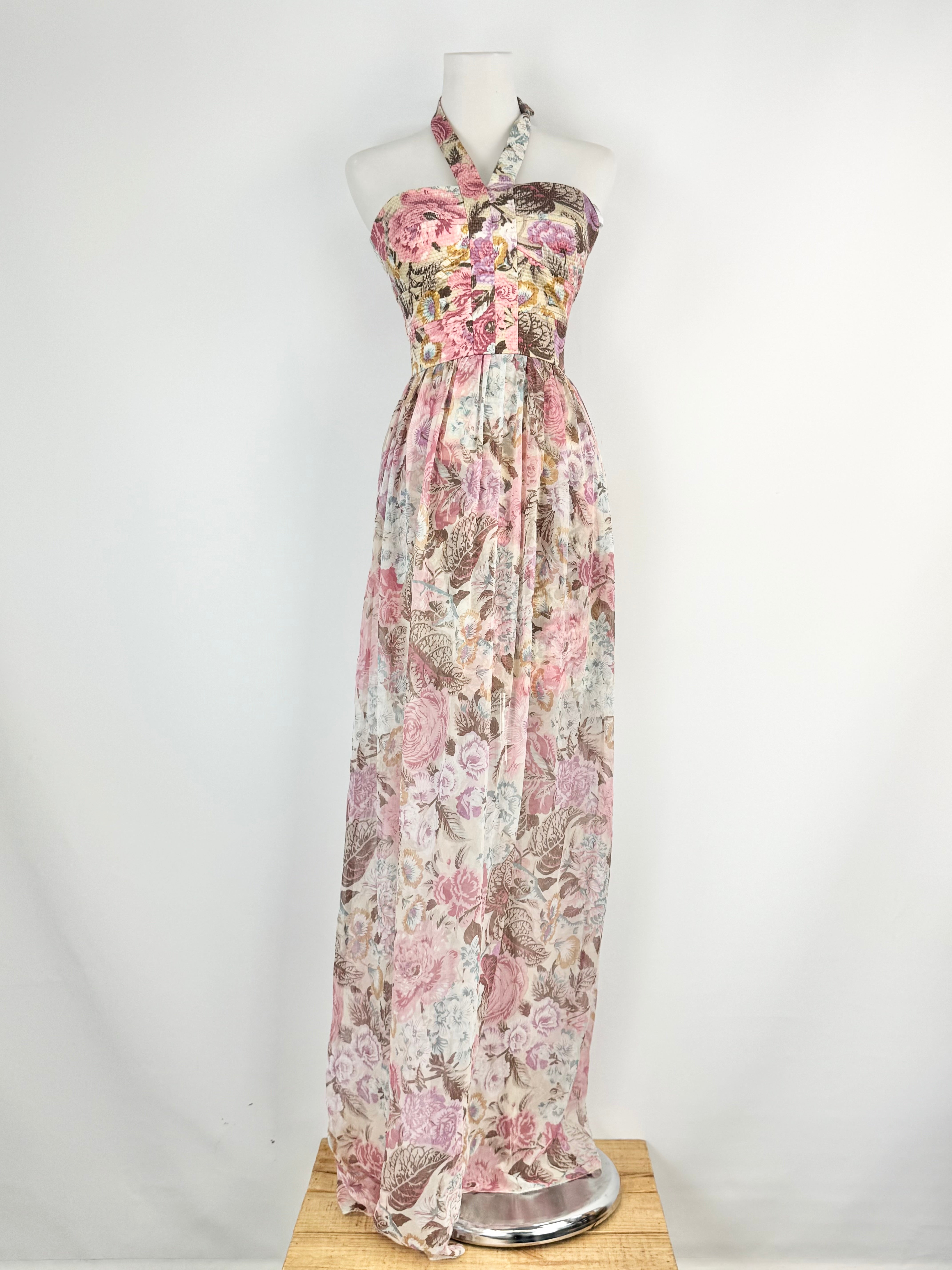 Floral patterned dress on a mannequin against a white background
