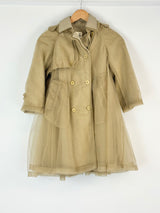 Beige trench coat with gold buttons on a white background